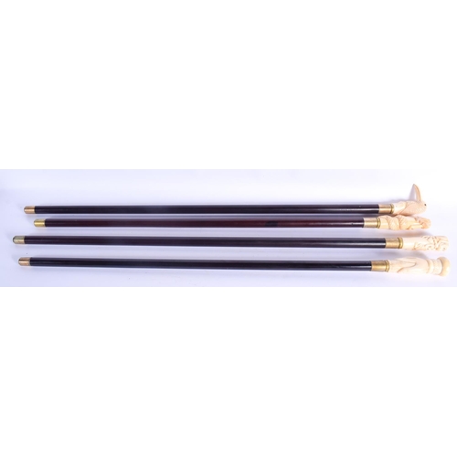 810 - FOUR UNUSUAL CONTINENTAL CARVED BONE WALKING CANES with wooden shafts. 92 cm long.