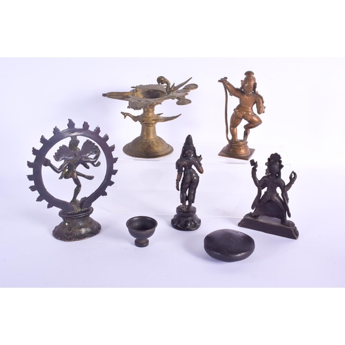 815 - AN 18TH CENTURY INDIAN HINDU BRONZE together with other figures etc. Largest 18 cm x 14 cm. (8)