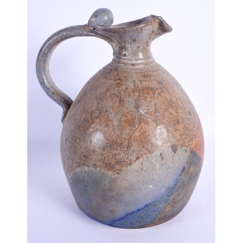 818 - AN UNUSUAL STONEWARE STUDIO POTTERY JUG. 24.5 cm high.