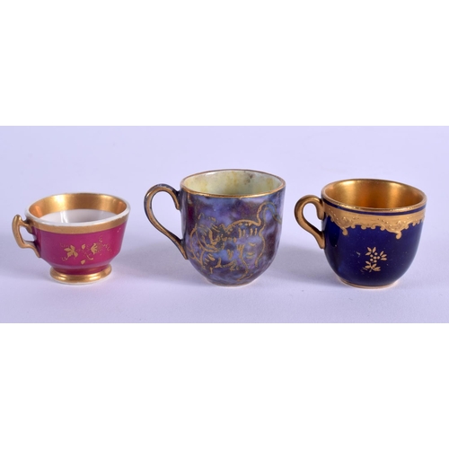 89 - WEDGWOOD LUSTRE MINIATURE CUP AND SAUCER with gilded decoration, a Coalport blue and raised gilt min... 