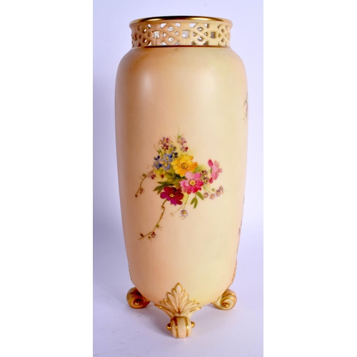 115 - Royal Worcester four footed vase with short pierced neck painted with flowers on a blush ivory groun... 