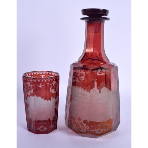 12 - A 19TH CENTURY BOHEMIAN RUBY GLASS DECANTER AND STOPPER together with a similar beaker. 24 cm high. ... 