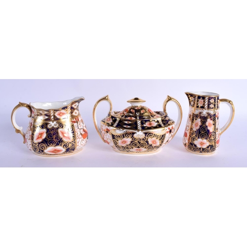 141 - Royal Crown Derby imari pattern 2451 boat shaped sugar bowl and cover, a milk jug and cream jug.  Bo... 