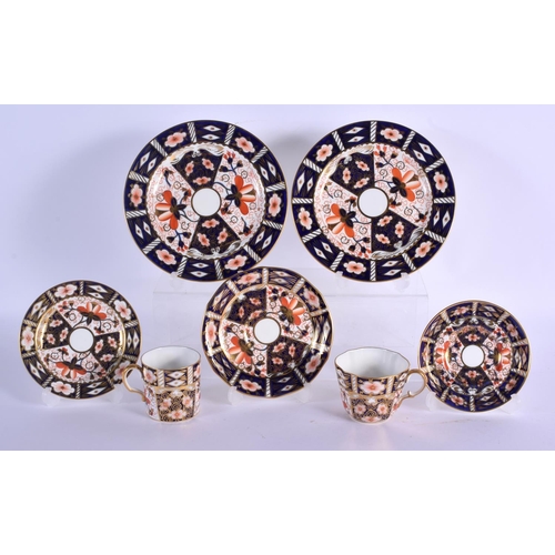 142 - Royal Crown Derby imari pattern 2451 cup and saucer, can and saucer, two bread plates and small plat... 