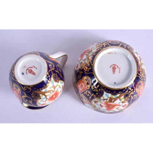 143 - Royal Crown Derby pattern 1952 cream jug and basin.  Jug 9.5cm high (2)