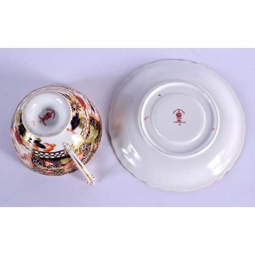 144 - Royal Crown Derby imari pattern 9022 cup and saucer.  Cup 5.5cm high, Saucer 14cm wide