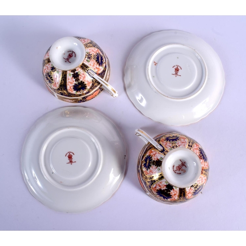 145 - Royal Crown Derby imari  pattern 1128  two pedestal cups and saucers.  Cup 5.5cm high, Saucer 14cm w... 