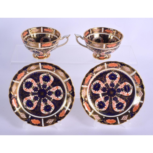 146 - Royal Crown Derby imari pattern 1128 two pedestal cups and saucers.  Cup 5.5cm high, Saucer 14cm wid... 