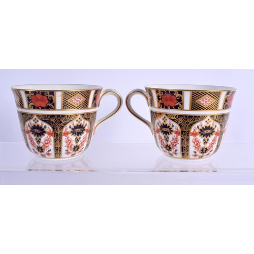 147 - Royal Crown Derby imari pattern 1128 two cups and saucers.  Cup 7cm high, Saucer 14.5cm wide (4)