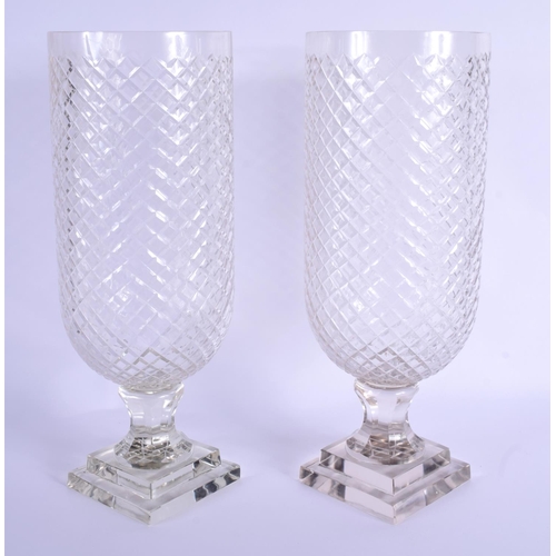 16 - A PAIR OF CUT GLASS STORM CELERY LAMPS. 39 cm high.