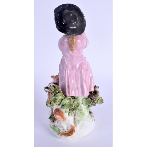 182 - 18th c. Derby figure of a boy standing beside a dog playing a pipe, patch marks.  18cm high