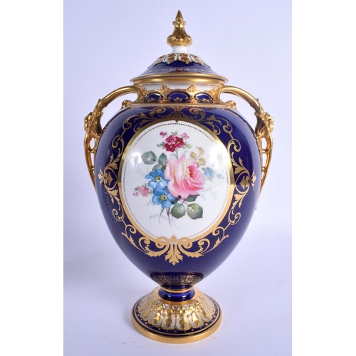 187 - Royal Crown Derby large vase and cover finely painted with flowers in a gilt panel on a cobalt blue ... 