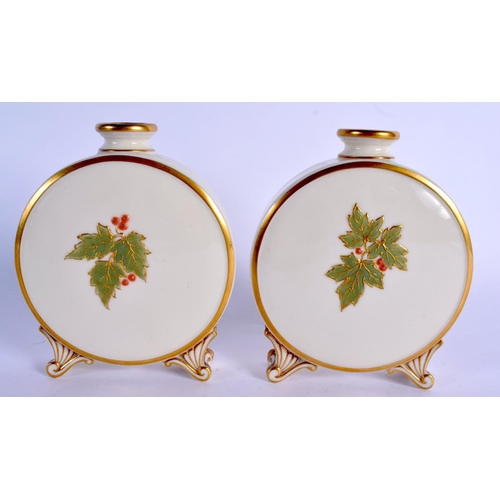 212 - Graingers Worcester pair of moon flasks in painted and moulded with leaves c. 1890.  13.5cm high (2)