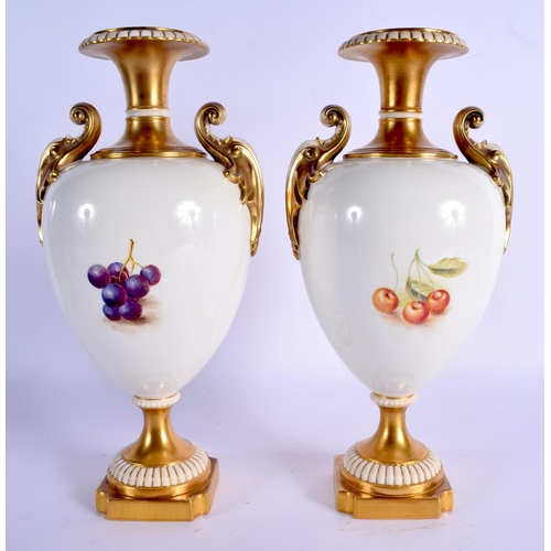 250 - A FINE PAIR OF ROYAL WORCESTER TWIN HANDLED PORCELAIN VASES by Freeman, wonderfully painted with pea... 