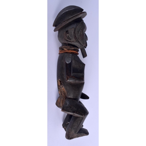 275 - AN AFRICAN TRIBAL CARVED WOOD FIGURE OF A BEADED MALE with vacant stomach. 42 cm high.