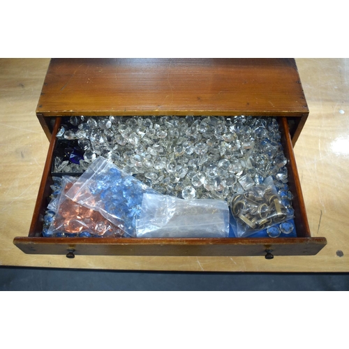 300 - AN 1950S PINE SPECIMEN OF WATCH MAKERS CHEST containing numerous cut glass prism drops etc. Box 27 c... 