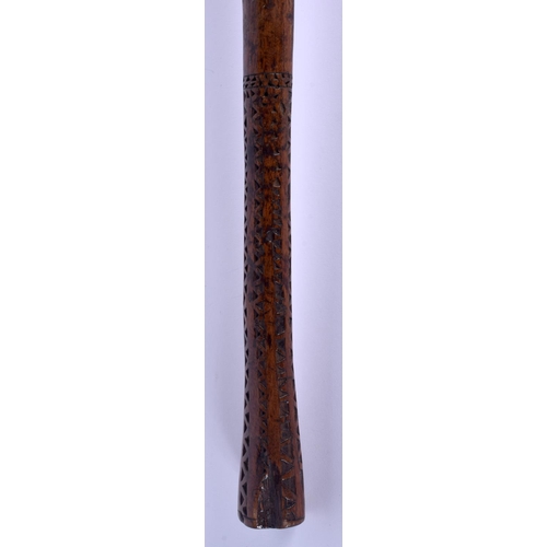 310 - A 19TH CENTURY POLYNESIAN TRIBAL CARVED WOOD KNOBKERRIE with zigzag handle. 38 cm long.