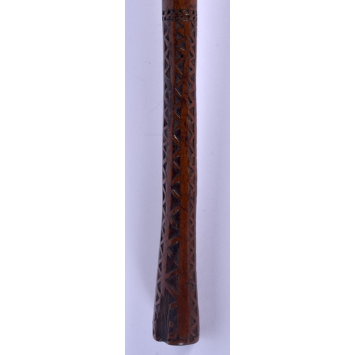 310 - A 19TH CENTURY POLYNESIAN TRIBAL CARVED WOOD KNOBKERRIE with zigzag handle. 38 cm long.