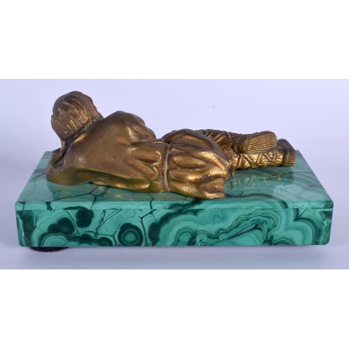 315 - A RARE 19TH CENTURY RUSSIAN GILT BRONZE FIGURE OF A RECLINING MALE modelled upon a malachite base. 1... 