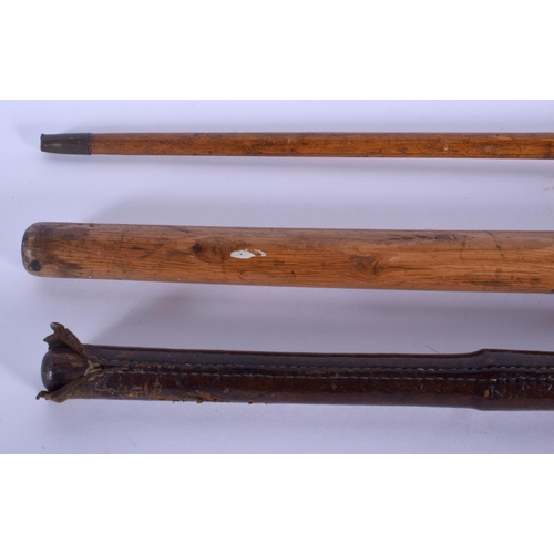 339 - AN ANTIQUE MULTI CARVED HARDWOOD SWAGGER STICK together with two others. Largest 84 cm long. (3)