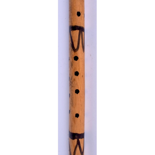 342 - AN UNUSUAL EARLY 20TH CENTURY PAINTED WOOD WALKING CANE with dimple decoration. 84 cm long.