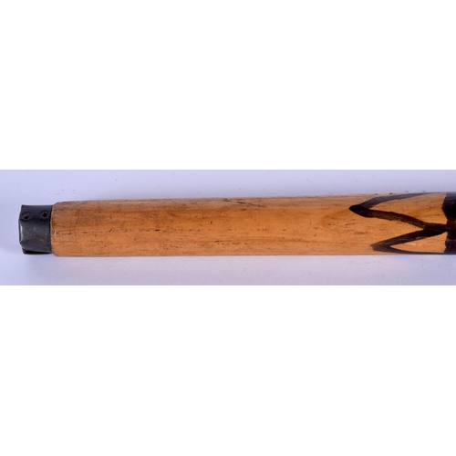 342 - AN UNUSUAL EARLY 20TH CENTURY PAINTED WOOD WALKING CANE with dimple decoration. 84 cm long.