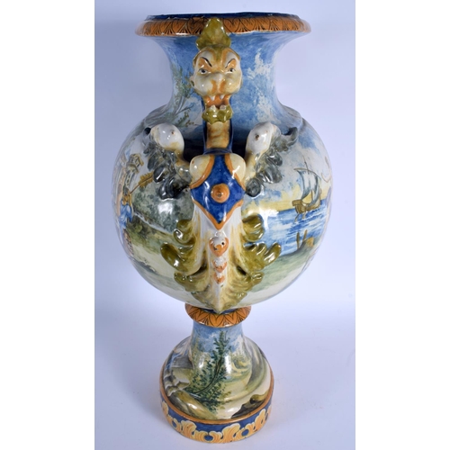 348 - A VERY LARGE 19TH CENTURY ITALIAN TWIN HANDLED MAJOLICA VASE painted with figures within landscapes.... 