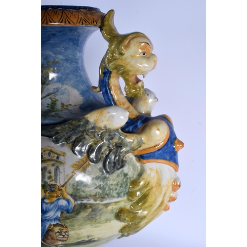 348 - A VERY LARGE 19TH CENTURY ITALIAN TWIN HANDLED MAJOLICA VASE painted with figures within landscapes.... 