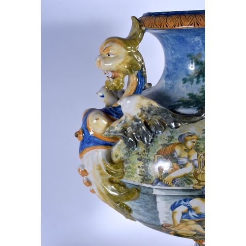 348 - A VERY LARGE 19TH CENTURY ITALIAN TWIN HANDLED MAJOLICA VASE painted with figures within landscapes.... 