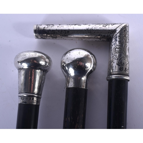 350 - THREE ANTIQUE SILVER TOPPED WALKING CANES. 90 cm long. (3)