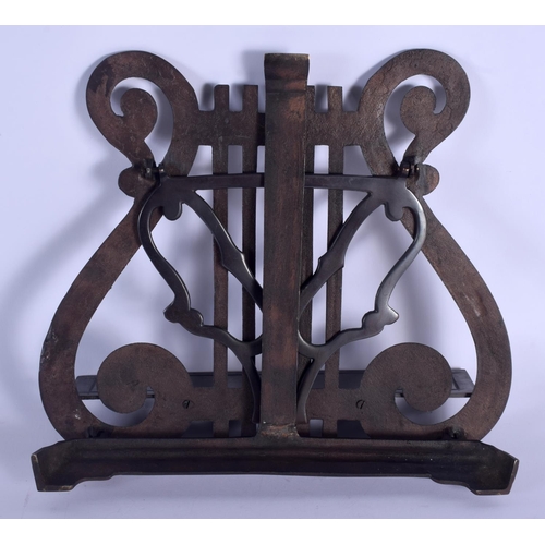 352 - A 1930S BRONZE TABLE TOP MUSIC STAND formed with musical notes. 27 cm x 27 cm.