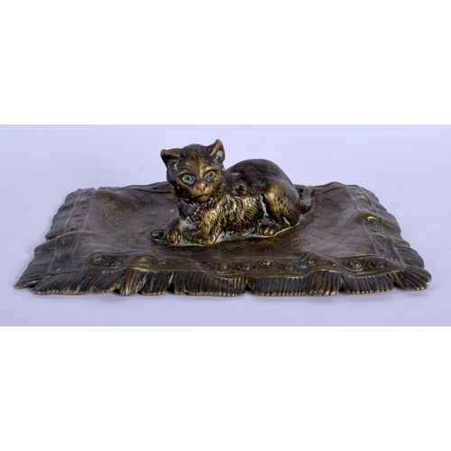 353 - A 19TH CENTURY AUSTRIAN BRONZE FIGURE OF A RECUMBENT CAT by Franz Xavier Bergmann, modelled upon a c... 