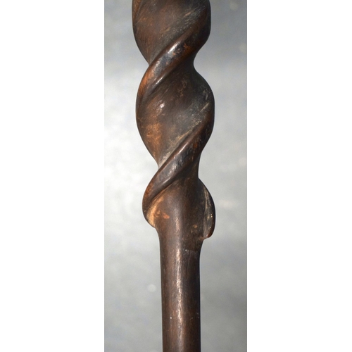 354 - A 19TH CENTURY AFRICAN TRIBAL CARVED WOOD PADDLE together with another similar. 155 cm long. (2)