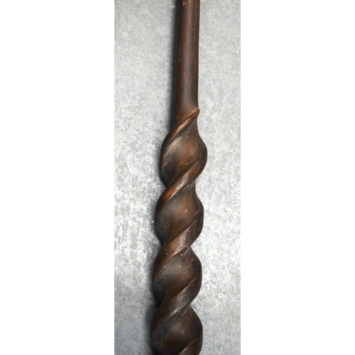 354 - A 19TH CENTURY AFRICAN TRIBAL CARVED WOOD PADDLE together with another similar. 155 cm long. (2)