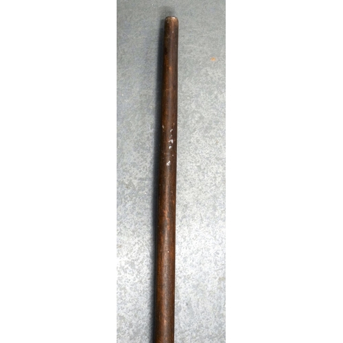 354 - A 19TH CENTURY AFRICAN TRIBAL CARVED WOOD PADDLE together with another similar. 155 cm long. (2)