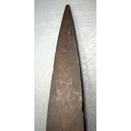 354 - A 19TH CENTURY AFRICAN TRIBAL CARVED WOOD PADDLE together with another similar. 155 cm long. (2)