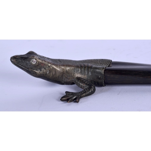 358 - A 19TH CENTURY CONTINENTAL BRONZE CAPPED HORN LIZARD possibly a paper knife. 23.5 cm long.