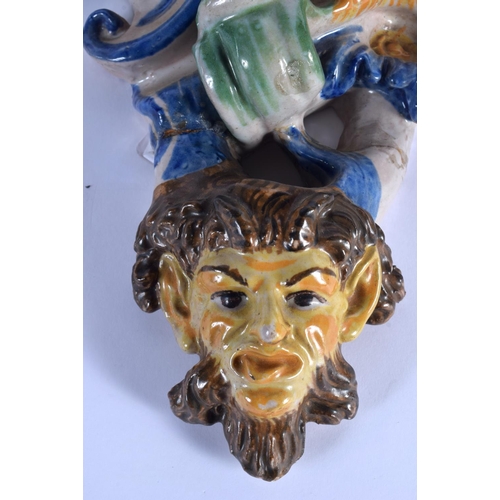 36 - A LARGE PAIR OF 19TH CENTURY ITALIAN MAJOLICA POTTERY WALL BRACKETS formed with figures over mask he... 