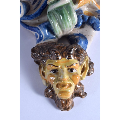 36 - A LARGE PAIR OF 19TH CENTURY ITALIAN MAJOLICA POTTERY WALL BRACKETS formed with figures over mask he... 