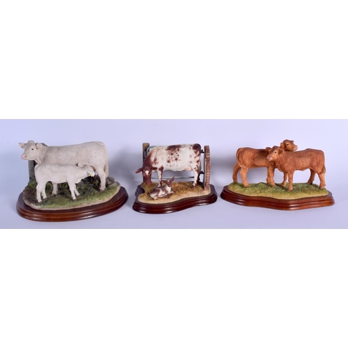 361 - A GROUP OF THREE BORDER FINE ARTS FIGURES OF COWS upon wooden plinths. Largest 20 cm x 15 cm. (3)