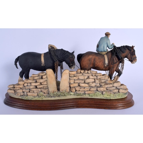 363 - A BORDER FINE ARTS FIGURE OF A SHIRE HORSES modelled with an attendant. 34 cm x 20 cm.