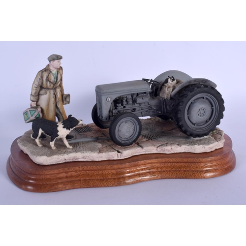 365 - A BORDER FINE ARTS FIGURE OF A MAN AND SHEEP DOG beside a tractor. 23 cm x 15 cm.