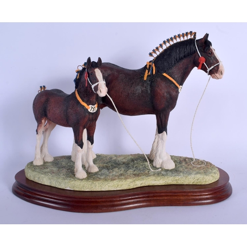 367 - A BORDER FINE ARTS FIGURE OF CHAMPION MARE & FOAL with certificate. 30 cm x 25 cm.