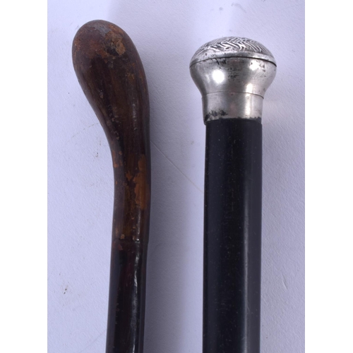 370 - A WWI FRENCH TRENCH ART TYPE SWAGGER STICK and another. 88 cm long. (2)