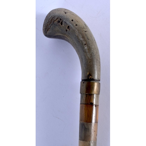 394 - A 19TH CENTURY CONTINENTAL FULL LENGTH RHINOCEROS AND BUFFALO HORN WALKING CANE. 88 cm long.