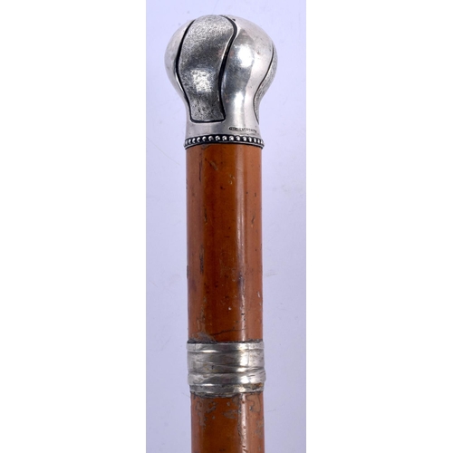 395 - AN ANTIQUE SILVER MOUNTED MALACCA WALKING CANE. 82 cm long.