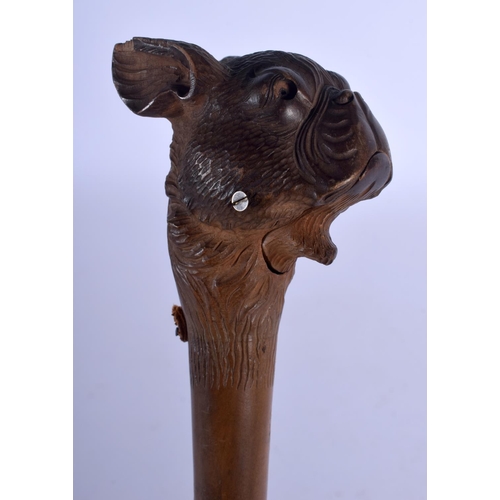 399 - A LATE 19TH CENTURY BAVARIAN BLACK FOREST ARTICULATED DOG HEAD PARASOL. 78 cm long.