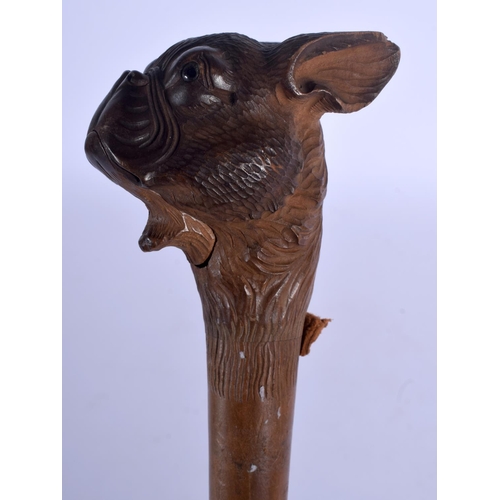 399 - A LATE 19TH CENTURY BAVARIAN BLACK FOREST ARTICULATED DOG HEAD PARASOL. 78 cm long.