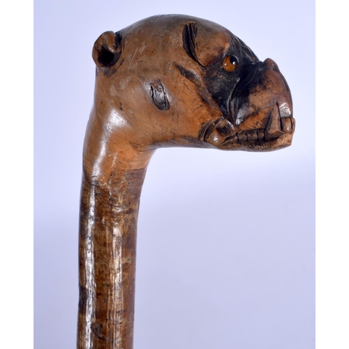 400 - AN EARLY 20TH CENTURY BAVARIAN BLACK FOREST DOG HEAD WALKING CANE. 88 cm long.