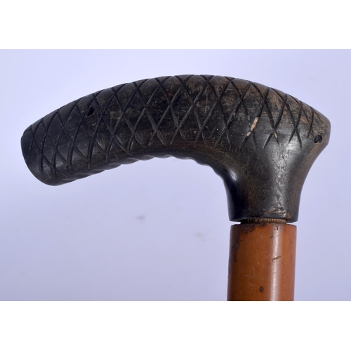 404 - A 19TH CENTURY CONTINENTAL CARVED RHINOCEROS HORN HANDLED WALKING CANE. 82 cm long.